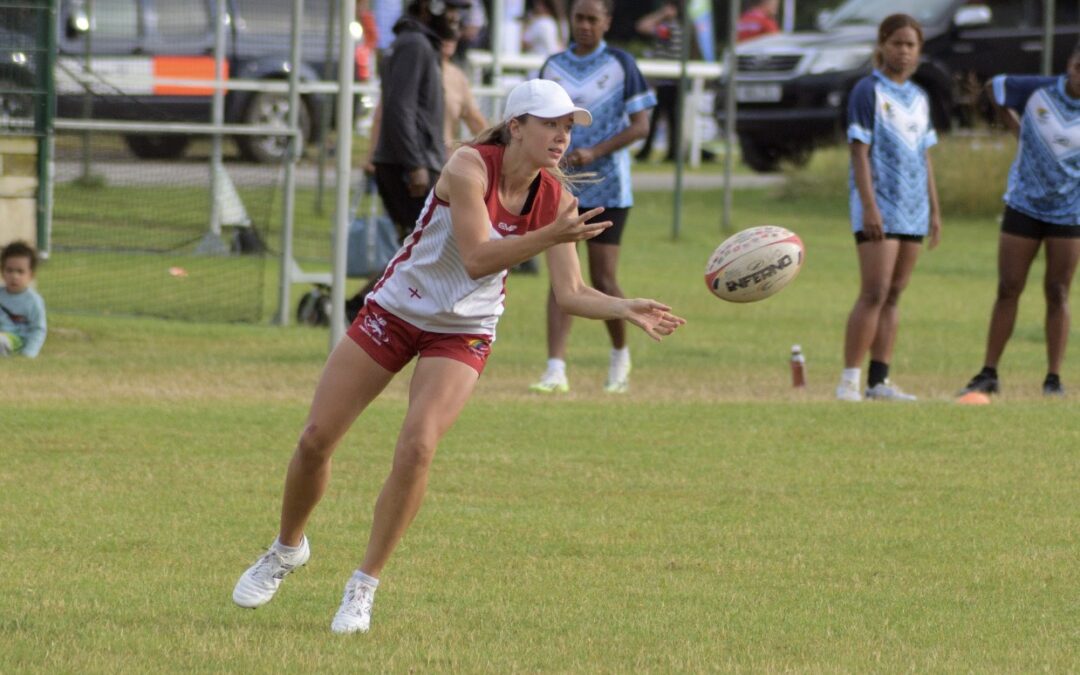 Emma Oliver, representing England, passing the ball to her teammate during a game at the world cup